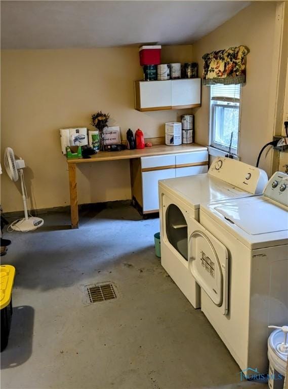 washroom featuring washing machine and dryer