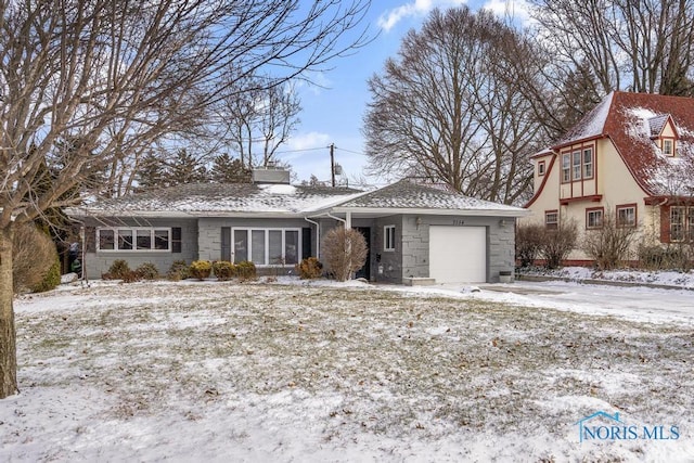 view of front of property with a garage