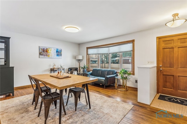 dining area with hardwood / wood-style flooring