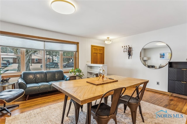 dining space with light wood-type flooring