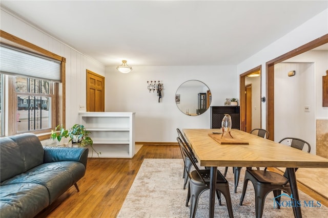 dining area with light hardwood / wood-style floors