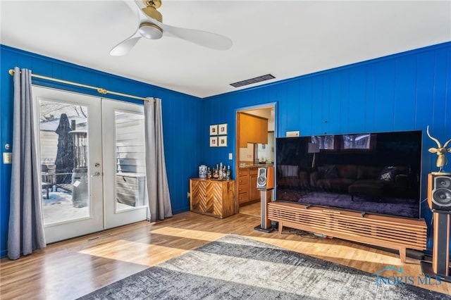 bedroom featuring french doors, ceiling fan, access to exterior, and hardwood / wood-style floors