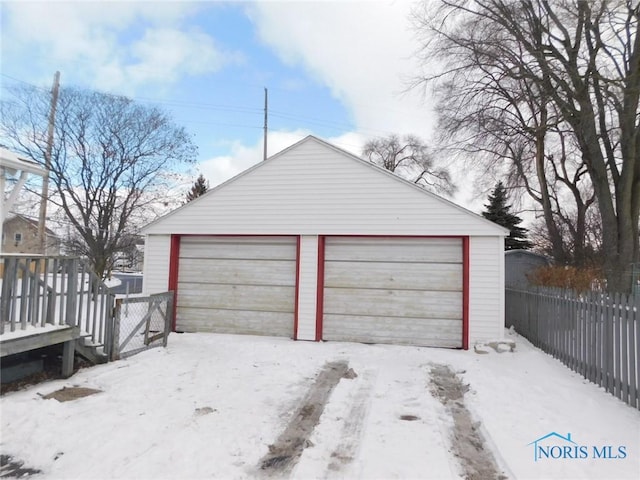 view of snow covered garage