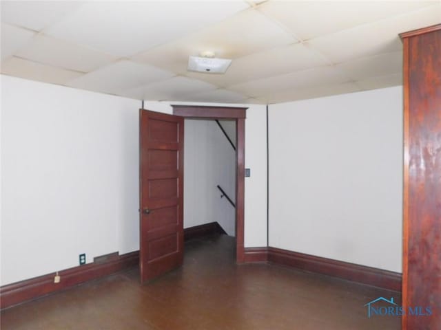 unfurnished room with a paneled ceiling