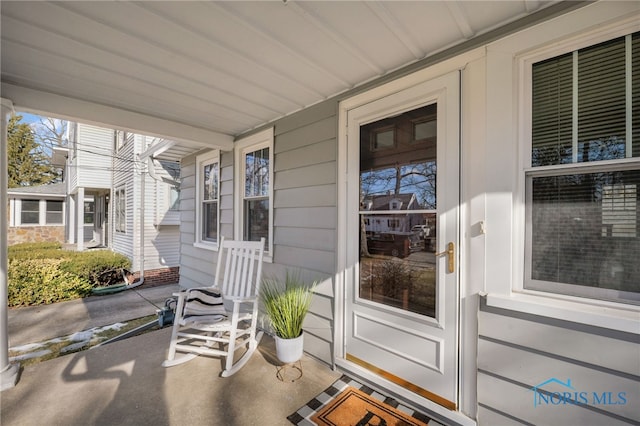 view of exterior entry with covered porch