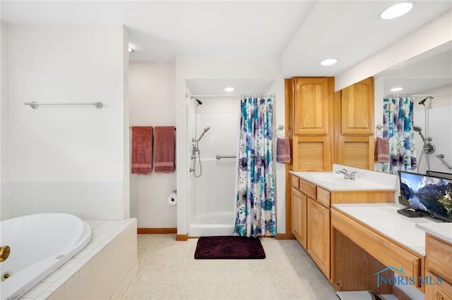 bathroom with independent shower and bath and vanity