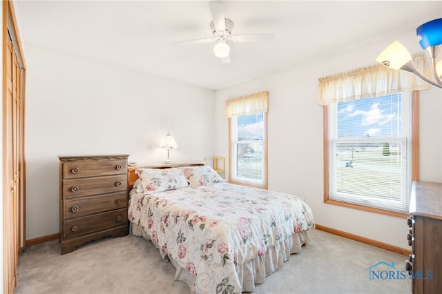 carpeted bedroom with ceiling fan