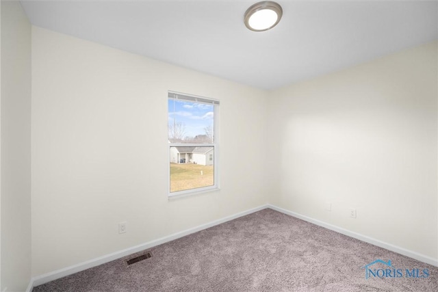 empty room with carpet flooring