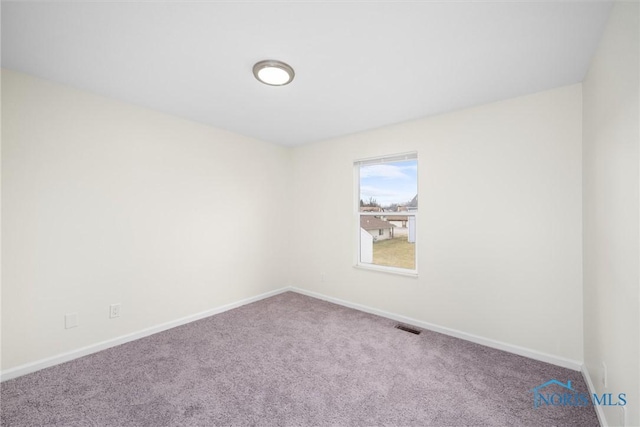 empty room featuring carpet flooring