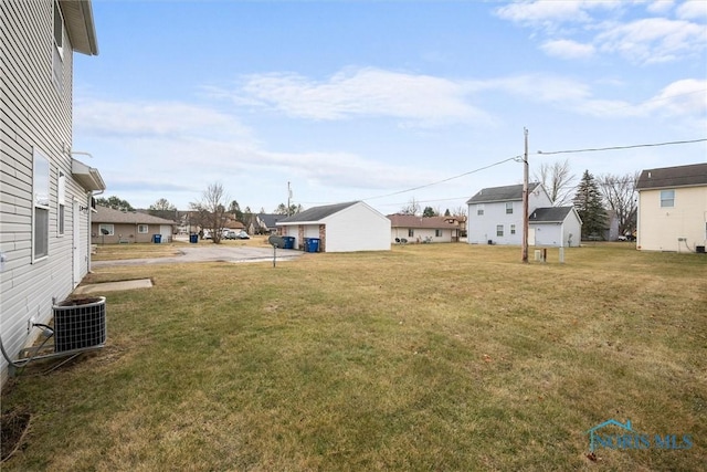 view of yard with central AC unit