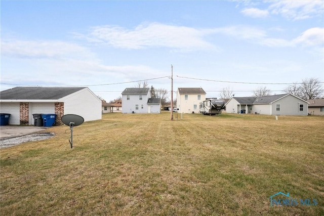 view of yard featuring a garage