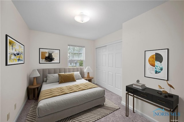 bedroom featuring a closet and carpet