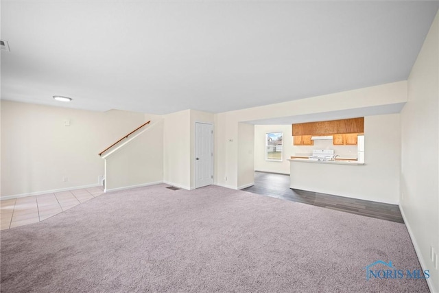 unfurnished living room with carpet floors