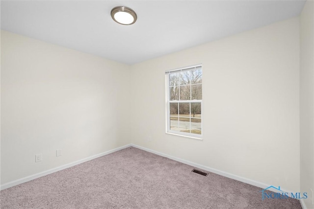 view of carpeted spare room