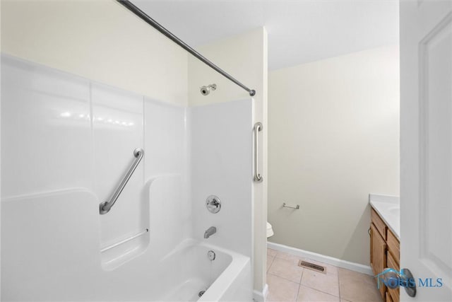 full bathroom with vanity, tile patterned floors, toilet, and shower / bath combination