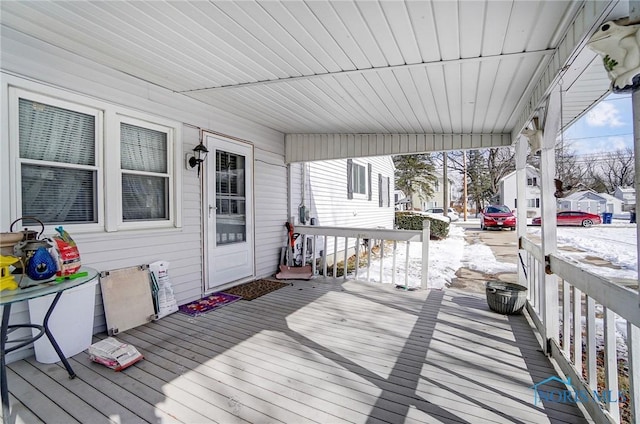 view of snow covered deck