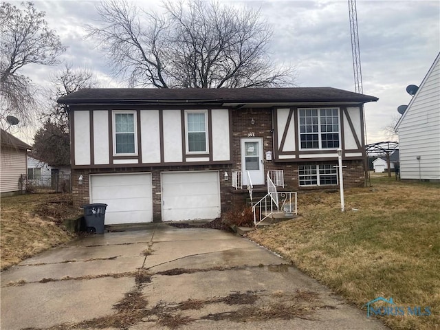 view of front of property featuring a garage and a front lawn