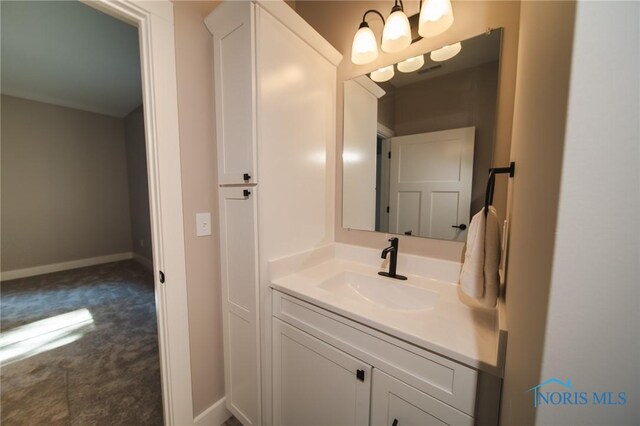 bathroom featuring vanity and a chandelier