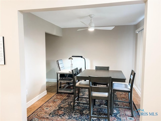 dining space featuring hardwood / wood-style floors and ceiling fan