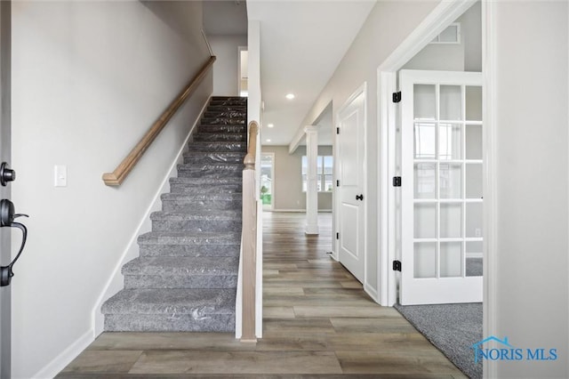 stairway featuring hardwood / wood-style floors