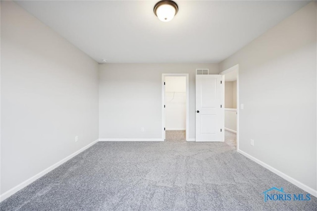 empty room with carpet flooring