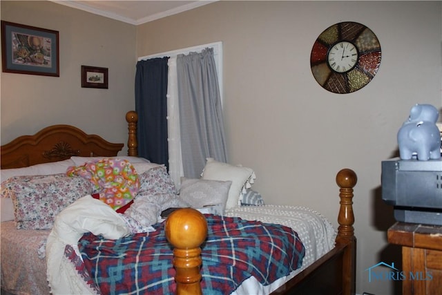 bedroom featuring crown molding