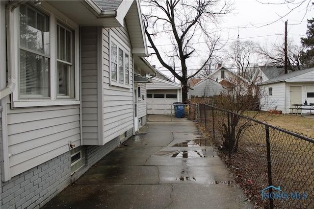 view of home's exterior with an outbuilding and a garage