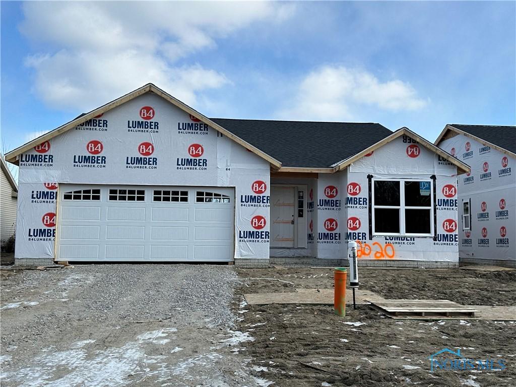 unfinished property featuring a garage