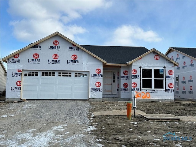 unfinished property featuring a garage