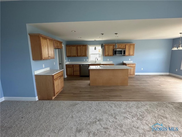 2016 Oakside, Toledo, OH 43615 - kitchen with stainless steel appliances, baseboards, a center island, and a sink