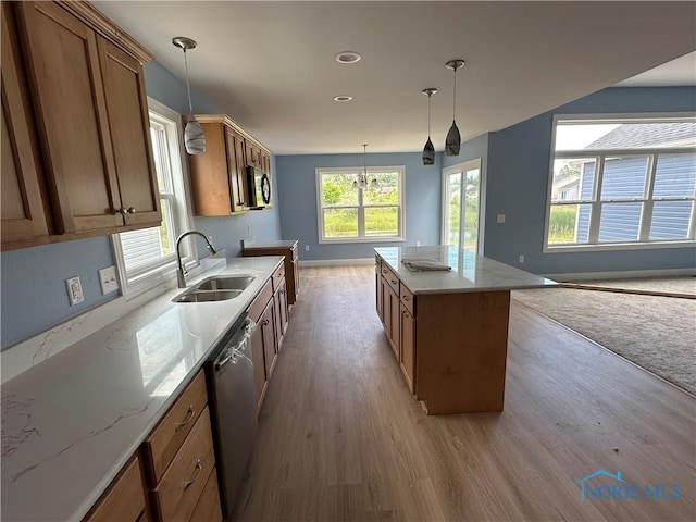 2016 Oakside, Toledo, OH 43615 - kitchen with a sink, light wood-type flooring, appliances with stainless steel finishes, brown cabinetry, and baseboards
