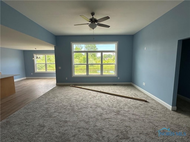 2016 Oakside, Toledo, OH 43615 - carpeted empty room with ceiling fan, baseboards, and a chandelier