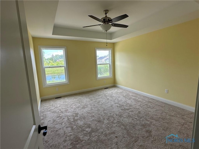 2016 Oakside, Toledo, OH 43615 - carpeted empty room with a raised ceiling, baseboards, and ceiling fan