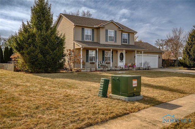 view of front of property with a porch, a garage, and a front lawn