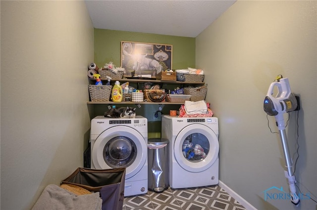 clothes washing area featuring independent washer and dryer and a textured ceiling