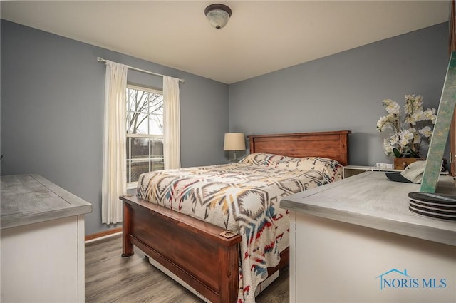 bedroom with light wood-type flooring