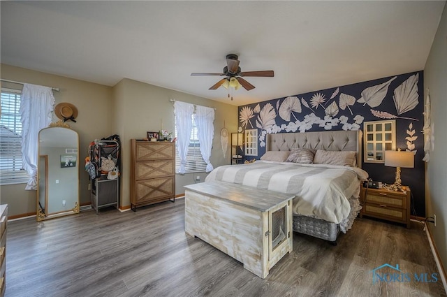 bedroom featuring ceiling fan and hardwood / wood-style floors