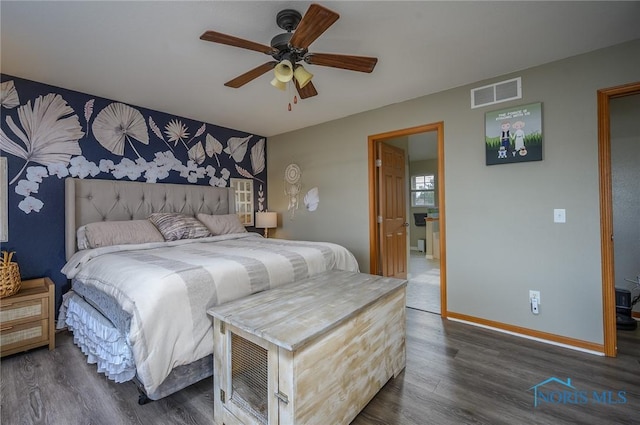 bedroom featuring ceiling fan and dark hardwood / wood-style floors