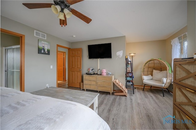 bedroom featuring ceiling fan and light hardwood / wood-style flooring