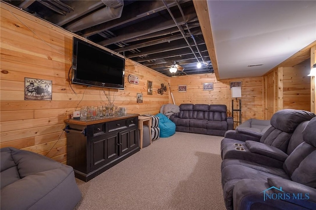 carpeted living room with wooden walls