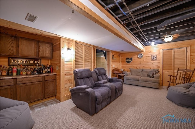 interior space with wooden walls and light carpet