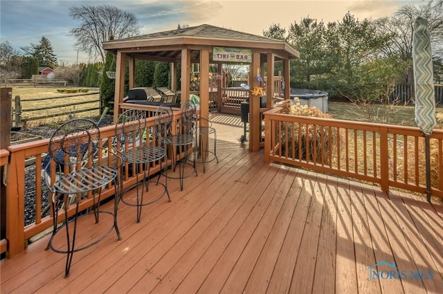 deck at dusk with a gazebo