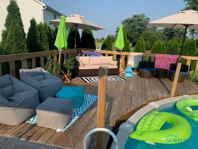 wooden terrace featuring outdoor lounge area