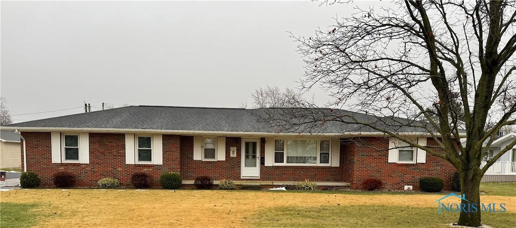 ranch-style home with a front yard