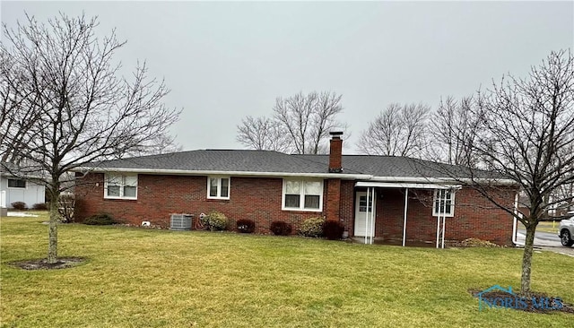 back of house featuring cooling unit and a lawn