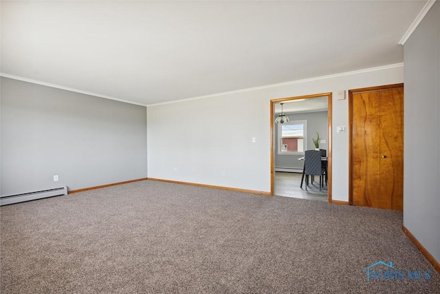 empty room featuring ornamental molding, baseboard heating, and carpet