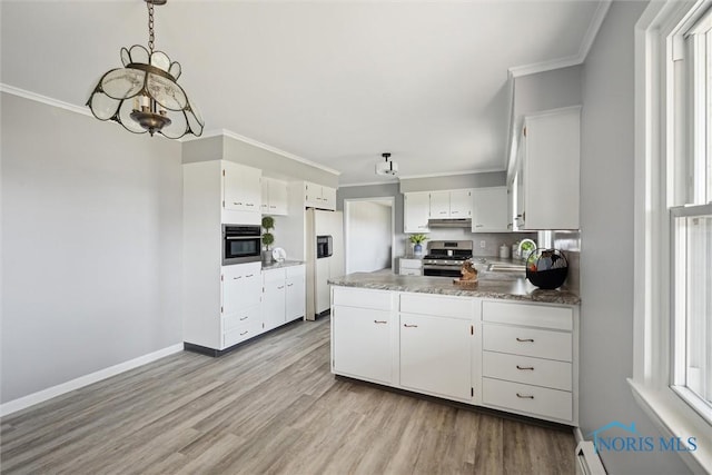 kitchen with sink, decorative light fixtures, ornamental molding, appliances with stainless steel finishes, and white cabinets