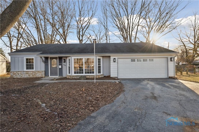 single story home featuring a garage