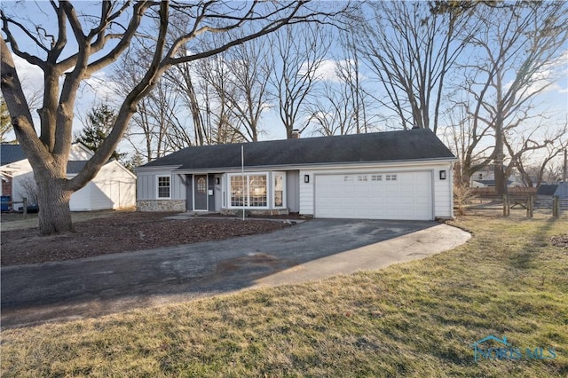 single story home with a garage and a front yard