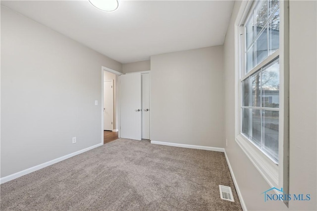 view of carpeted spare room